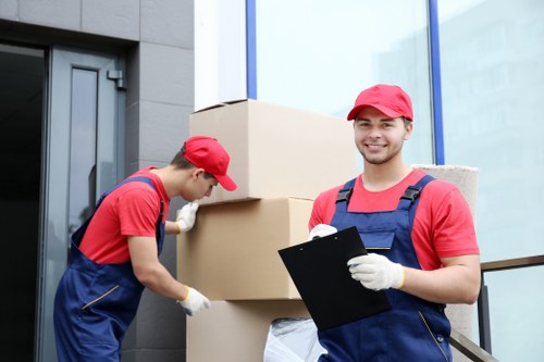 Removal team handling furniture during a Brentford apartment move