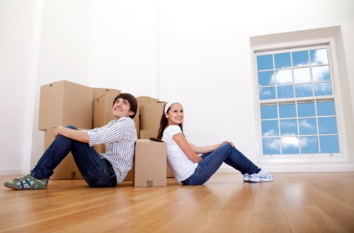 Local Brentford movers loading furniture into a removal van