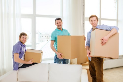 Brentford removals team loading furniture into a moving van