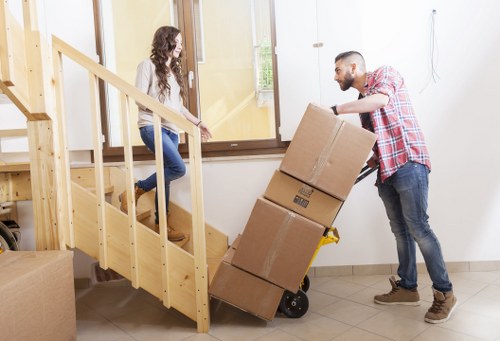 Careful wrapping of fragile items for a Brentford house move