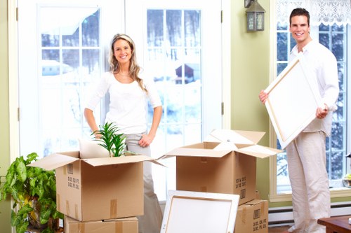 Efficient packing team organizing household items in Brentford